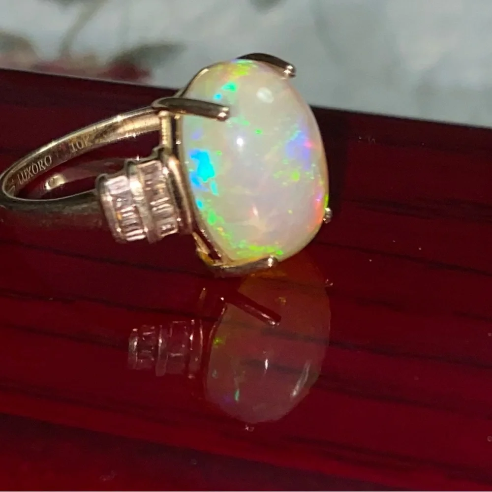 AAA Ethiopian Welo 7.56 cwt Opal and G-H SI Diamond Ring in 10 k gold size 7
